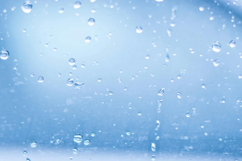 a close up of water droplets on a window, an album cover, unsplash, conceptual art, light blue background, background image, hydration, low pressure system