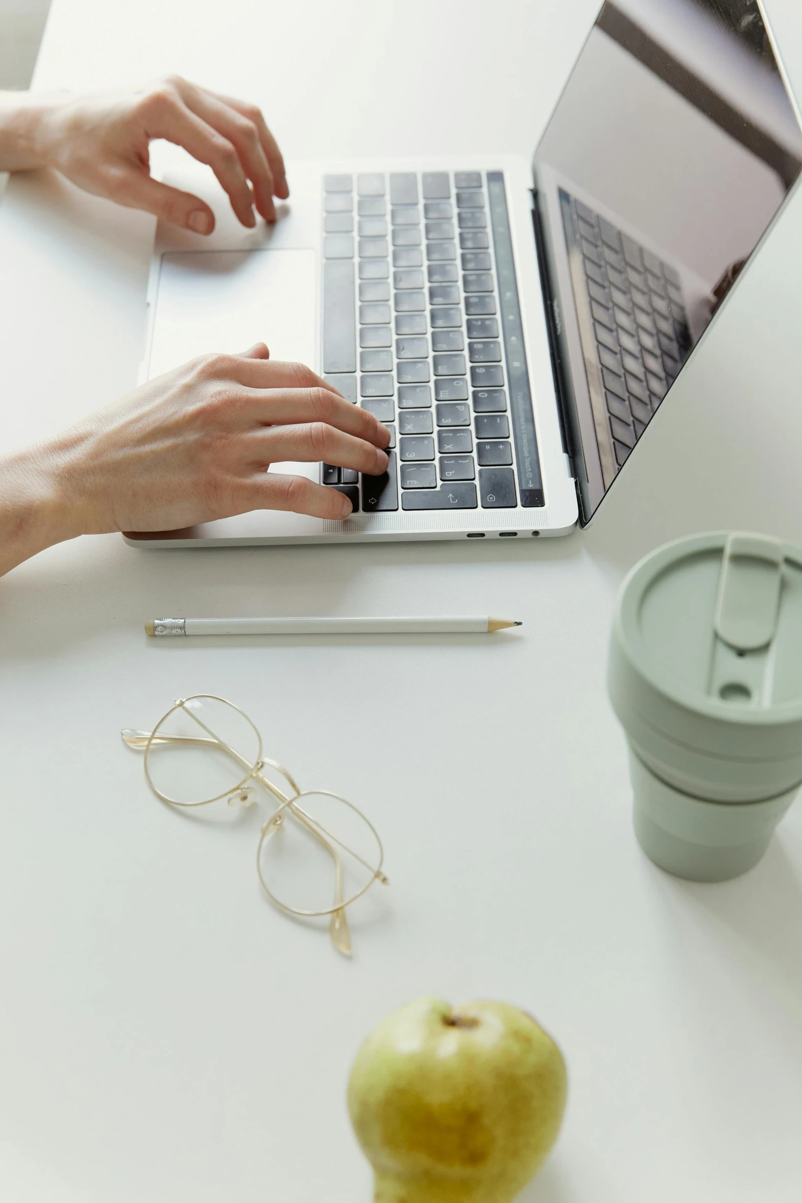 a close up of a person typing on a laptop, by Carey Morris, trending on pexels, paper cup, glasses without frames, sustainable materials, white background and fill