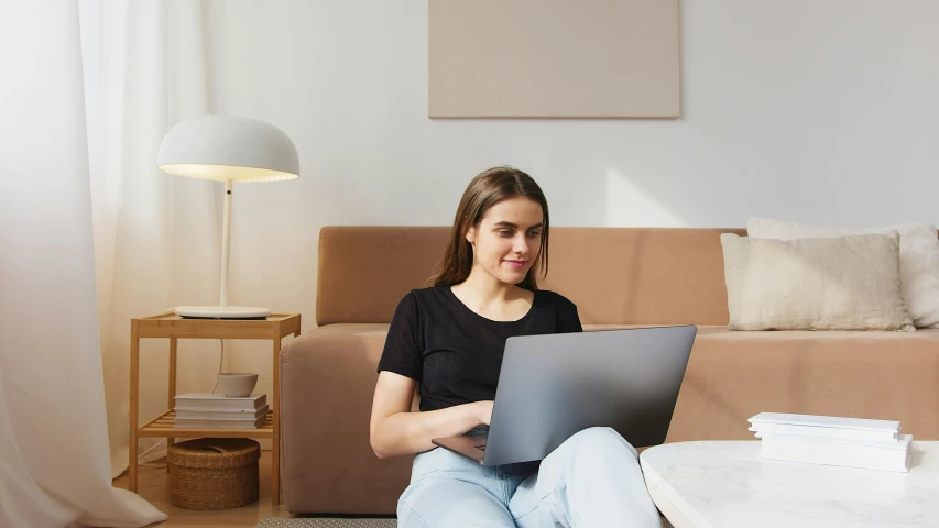 a woman sitting on the floor using a laptop, trending on pexels, avatar image, at the sitting couch, high resolution image, student