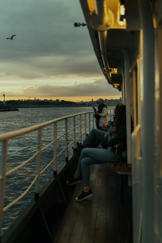 a couple of people that are sitting on a boat, 8k 28mm cinematic photo, istanbul, golden hour 4k, helsinki