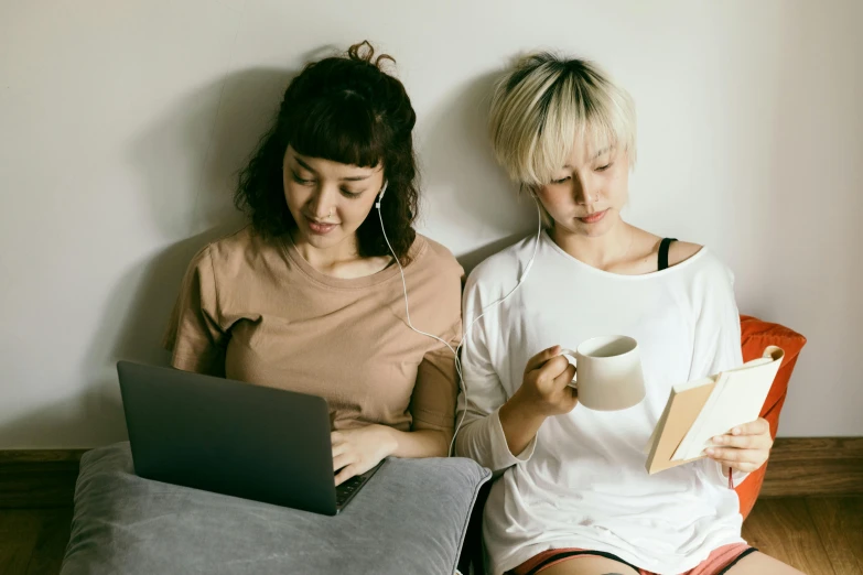 a couple of women sitting next to each other on a couch, trending on pexels, computer art, sitting on the bed, studious, girl with short white hair, everything fits on the screen