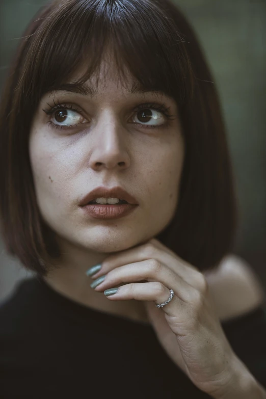 a woman with a ring on her finger, a character portrait, inspired by Elsa Bleda, pexels contest winner, hyperrealism, center parted bangs, beautiful lonely girl, strong jawline, french bob
