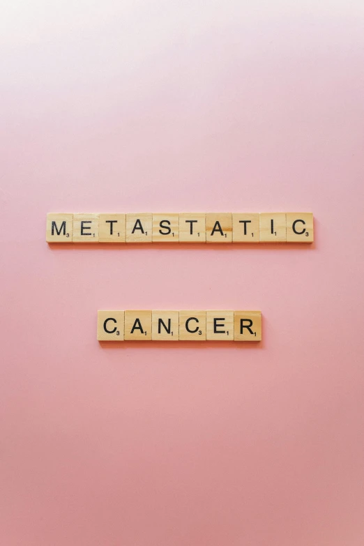 scrabbles spelling meta statio cancer on a pink background, an album cover, pixabay, doing a majestic pose, flatlay, genetic, 64x64