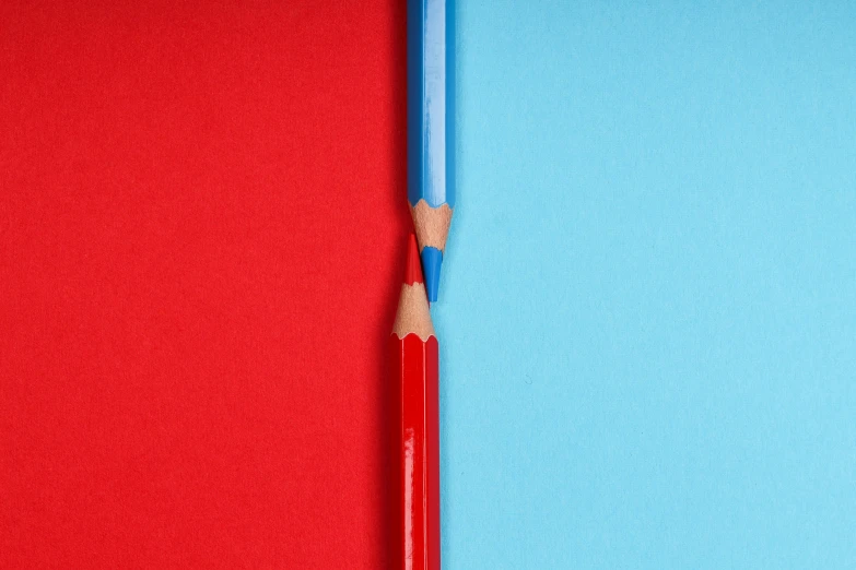 two pencils next to each other on a red and blue background, pexels contest winner, postminimalism, instagram photo, red and cyan, opening shot, half-tone-line-stacking