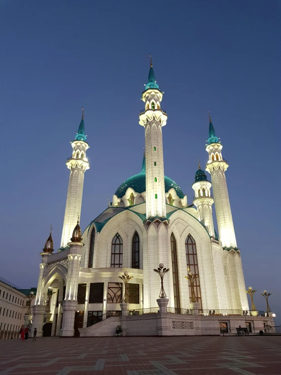 a large white mosque lit up at night, inspired by Illarion Pryanishnikov, hurufiyya, square, medium-shot, green, low quality photo