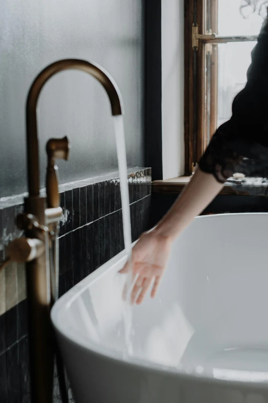 a woman washing her hands in a bathtub, trending on unsplash, mix with rivendell architecture, brass and steam technology, thumbnail, tall