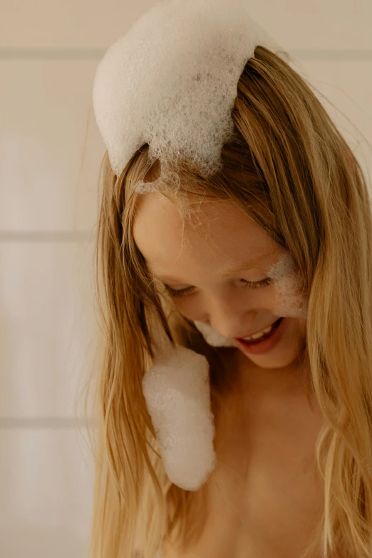 a young girl in a bathtub with foam on her head, by Alice Mason, trending on unsplash, slide show, blond, detail shot, teenage girl