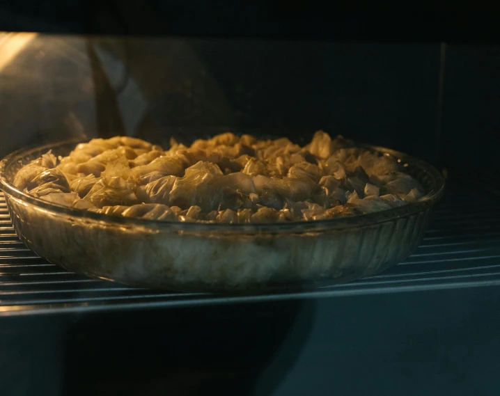 a close up of a pie baking in an oven, inspired by Elsa Bleda, cinematic still frame, mac and cheese, rear-shot, album