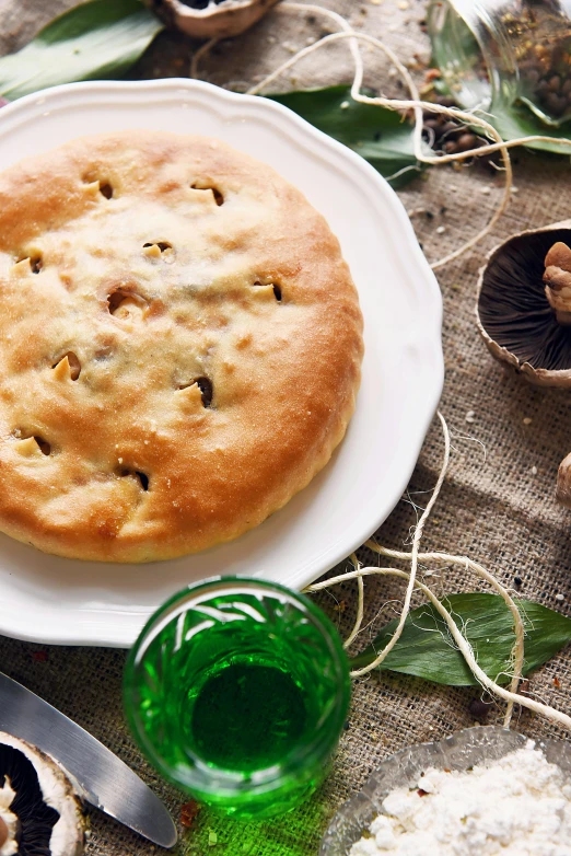 a close up of a plate of food on a table, inspired by Géza Dósa, shutterstock, renaissance, apple pie, mongolia, bread, anna nikonova