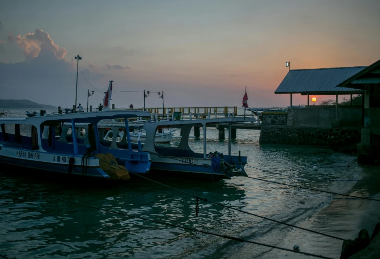 a couple of boats that are sitting in the water, pexels contest winner, near a jetty, humid evening, thumbnail, bali