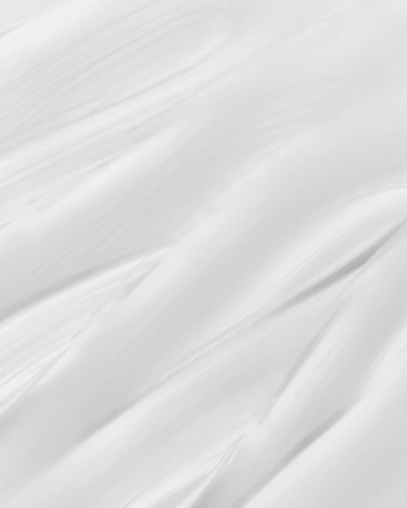 a man riding a snowboard down a snow covered slope, an ambient occlusion render, unsplash, carved marble texture silk cloth, white marble texture, texture detail, detailed product image