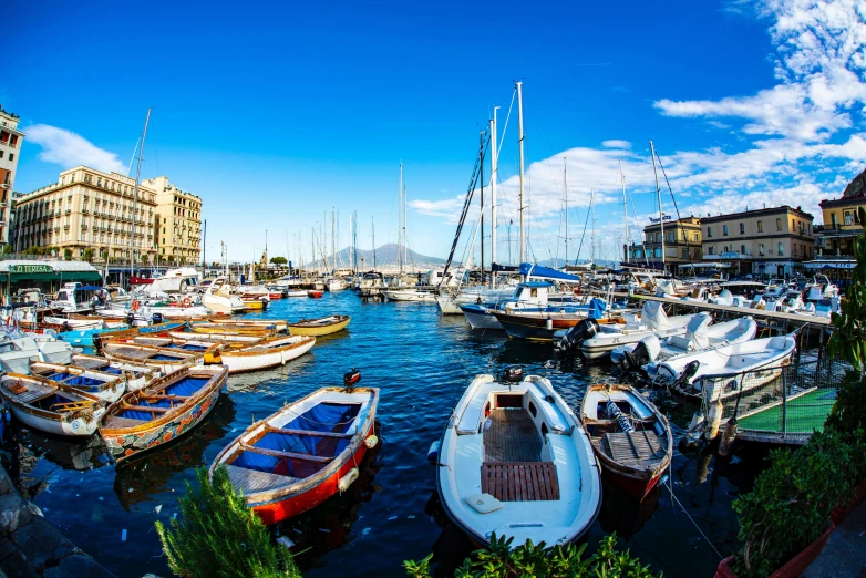 a harbor filled with lots of boats under a blue sky, by Giuseppe Avanzi, pexels contest winner, 💋 💄 👠 👗, naples, thumbnail, al fresco