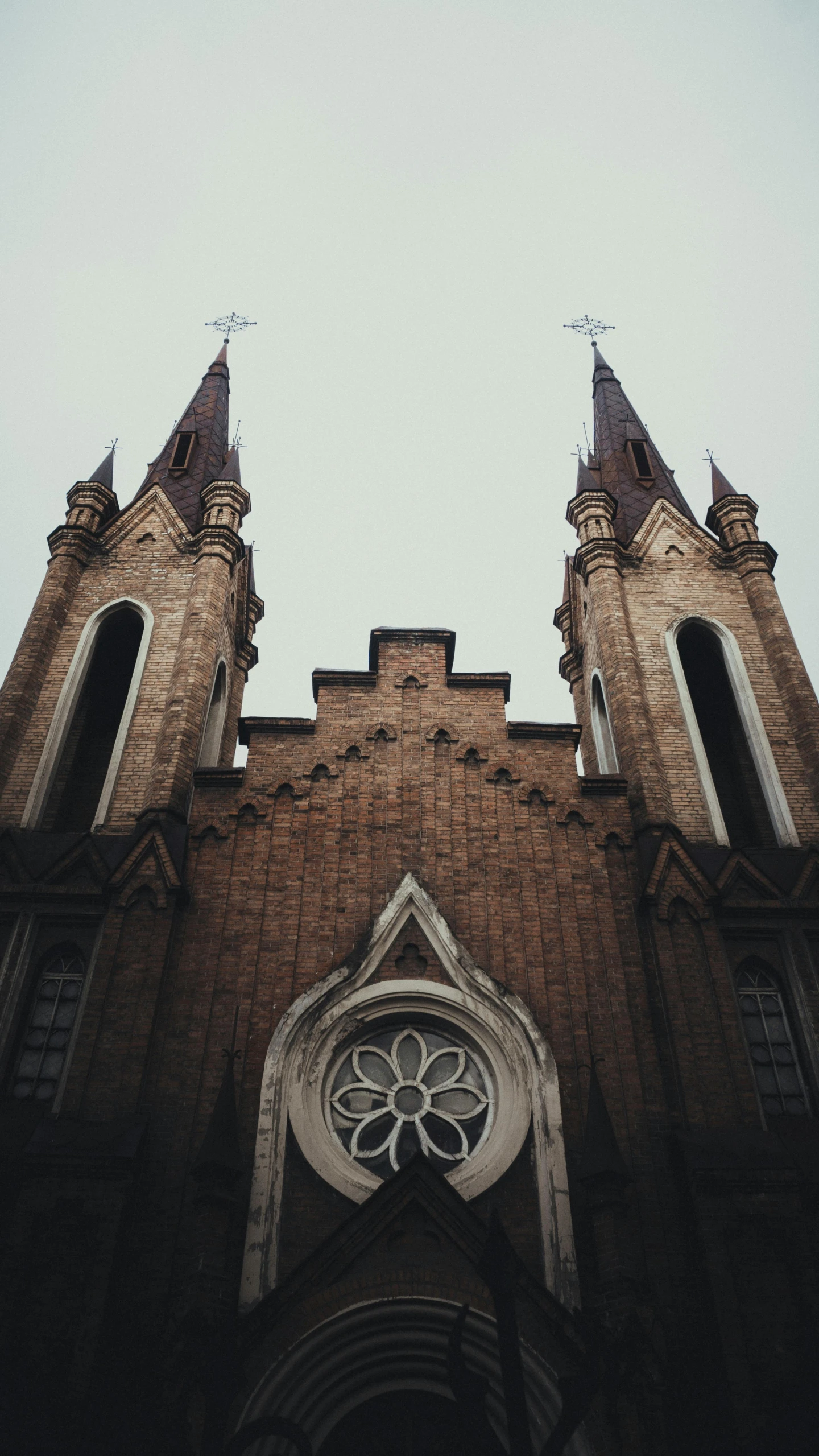 a church with a clock on the front of it, an album cover, unsplash contest winner, trending on vsco, gothic revival, symmetrical front view, 15081959 21121991 01012000 4k