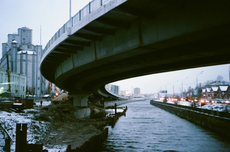 a bridge that is over a body of water, an album cover, inspired by Elsa Bleda, unsplash, hurufiyya, moscow, urban surroundings, photo taken on fujifilm superia, under construction