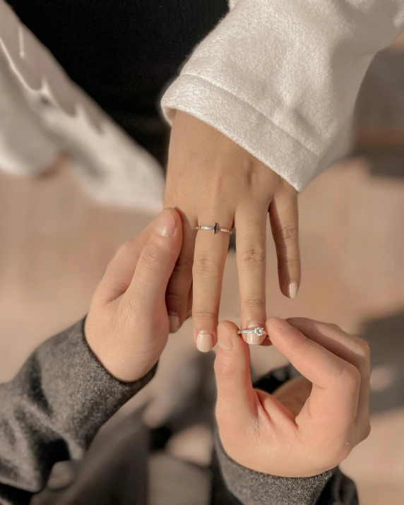 a man putting a ring on a woman's finger, pexels contest winner, instagram story, silver，ivory, pokimane, 15081959 21121991 01012000 4k