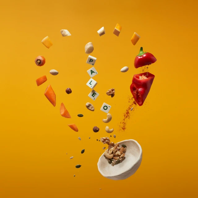 a bowl of food that is flying in the air, by Andries Stock, pexels contest winner, fantastic realism, on a yellow canva, exploded view, spicy, playful composition