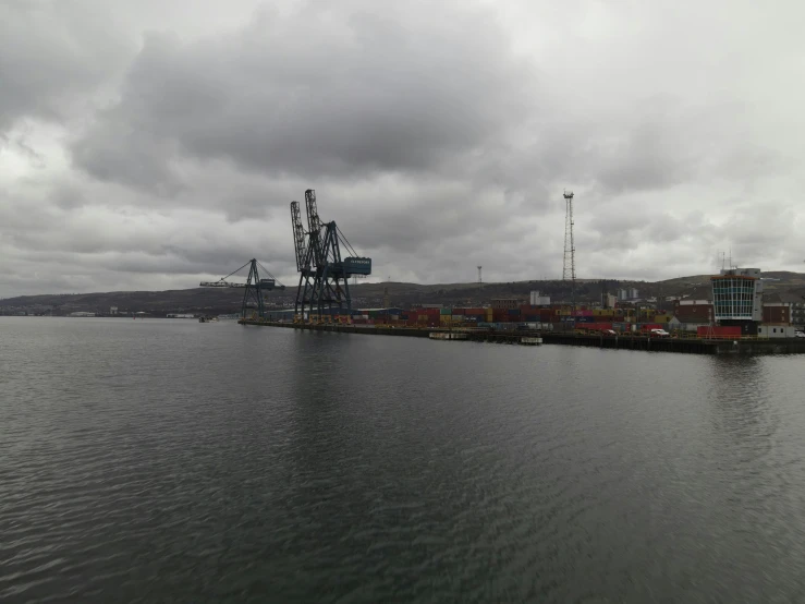 a large body of water under a cloudy sky, shipping docks, paisley, 2022 photograph, faroe