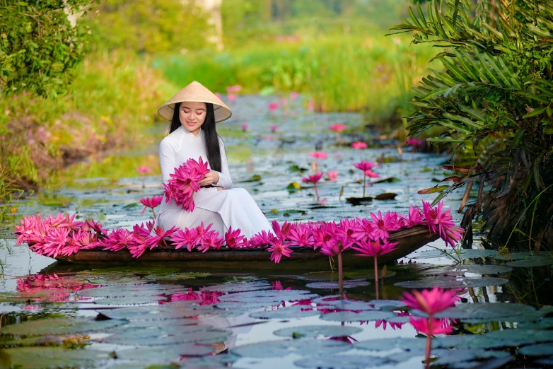 a woman in a boat filled with pink flowers, ao dai, avatar image