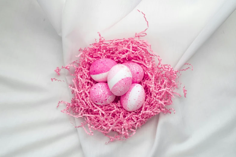 a nest filled with pink and white easter eggs, inspired by Peter Alexander Hay, pexels contest winner, white neon wash, high angle shot, sweets, detailed product image