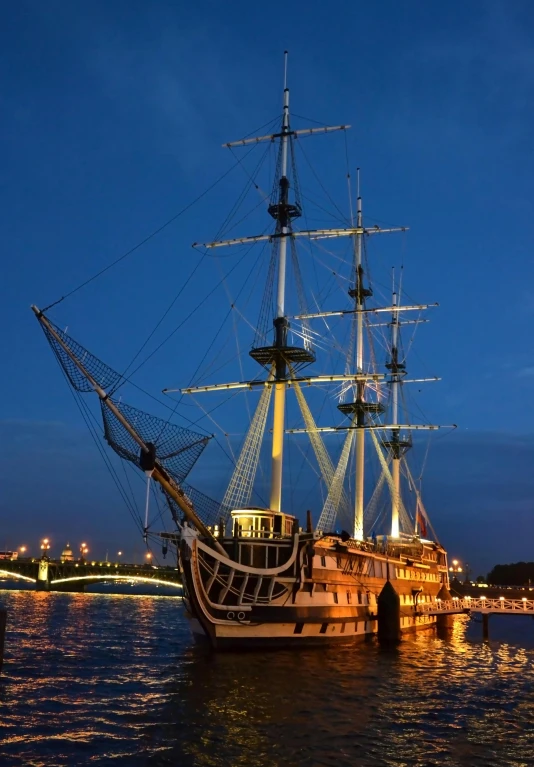 a large boat floating on top of a body of water, a portrait, inspired by Ivan Aivazovsky, pexels contest winner, night lights, square, three masts, patriotic