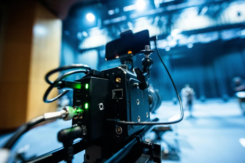 a close up of a camera on a tripod, theatre stage, back towards camera, motion capture system, getty images proshot