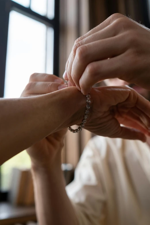 a close up of a person putting a ring on another person's finger, by Nina Hamnett, bracelets, groom, by greg rutkowski, long