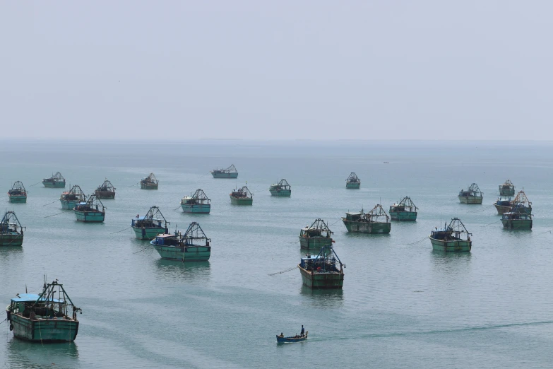 a group of boats floating on top of a body of water, an album cover, inspired by Zhang Kechun, flickr, hurufiyya, floating. greenish blue, sri lankan landscape, fish seafood markets, image dataset