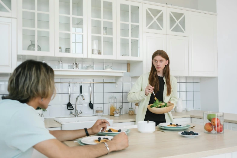 a man and a woman sitting at a kitchen table, pexels contest winner, salad and white colors in scheme, aurora aksnes, hammershøi, annoyed