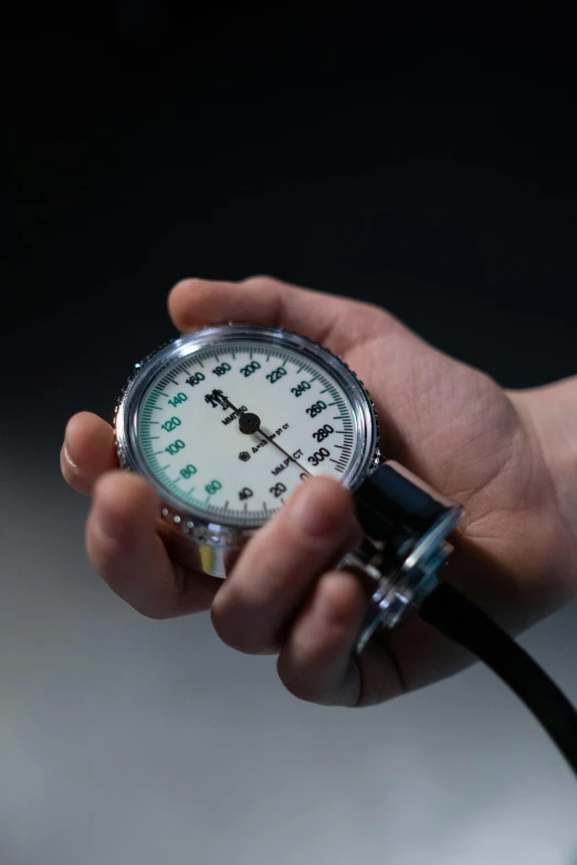 a person holding a gauge in their hand, by Jason Felix, medical equipment, ap, square, high quality picture