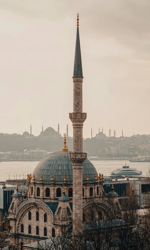 a large building next to a body of water, by Ismail Acar, pexels contest winner, hurufiyya, neoclassical tower with dome, ottoman sultan, panorama view, 256x256