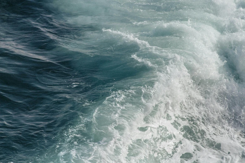 a man riding a wave on top of a surfboard, an album cover, pexels contest winner, hurufiyya, pristine rippling oceanic waves, ship at sea, glistening seafoam, texture