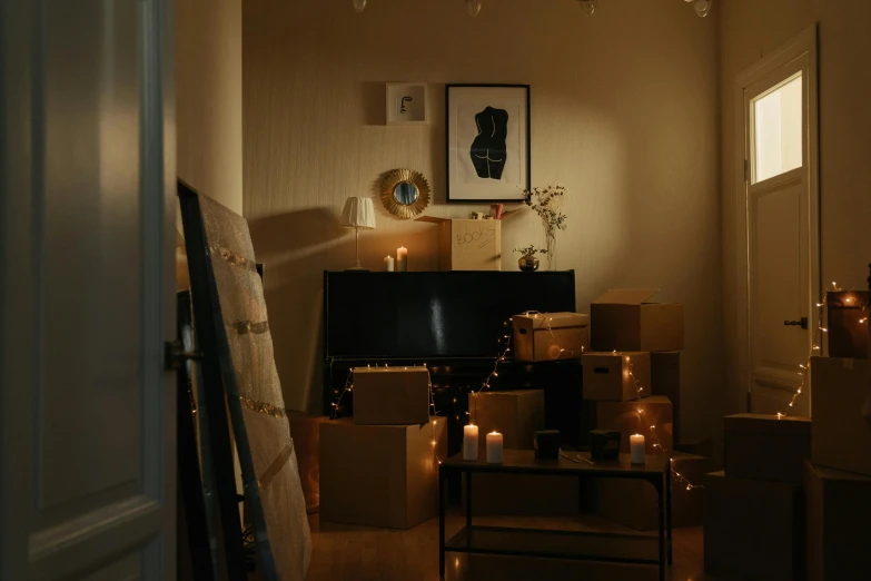 a living room filled with boxes and candles, inspired by Elsa Bleda, pexels contest winner, movie still frame, small bedroom, concert, promo image