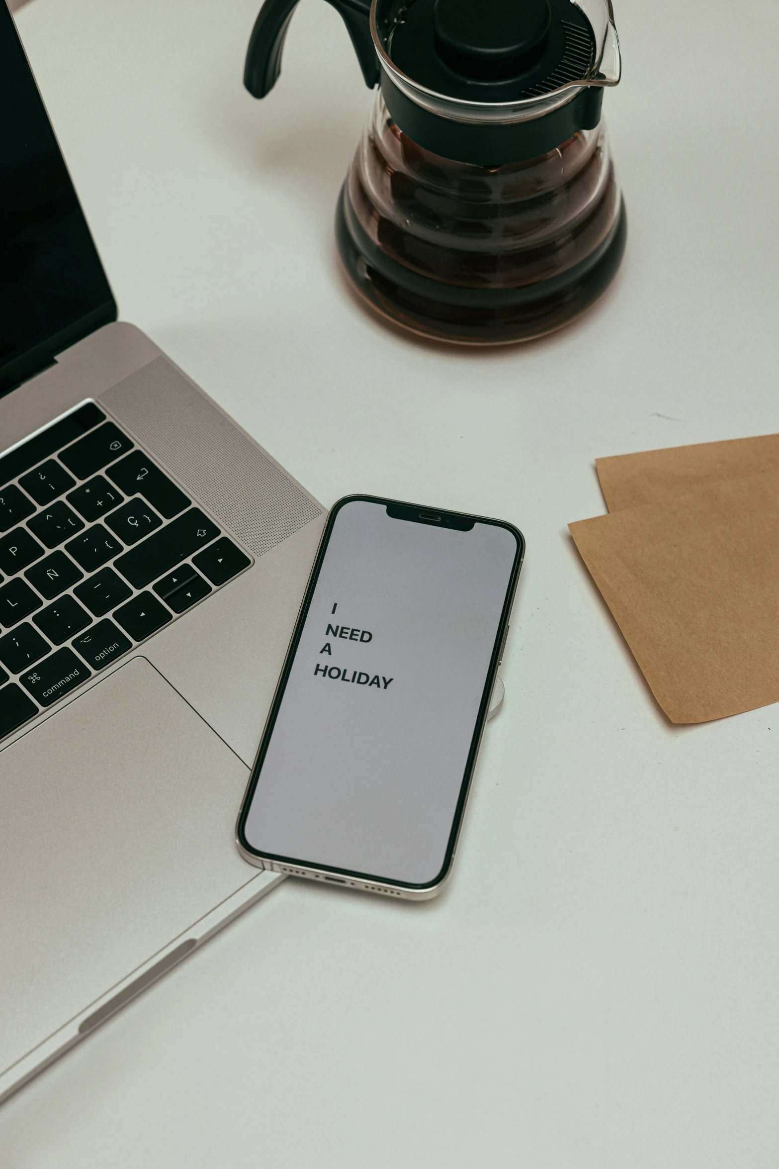 a laptop computer sitting on top of a white table, by Adam Rex, trending on pexels, corporate phone app icon, holiday, brown, grey