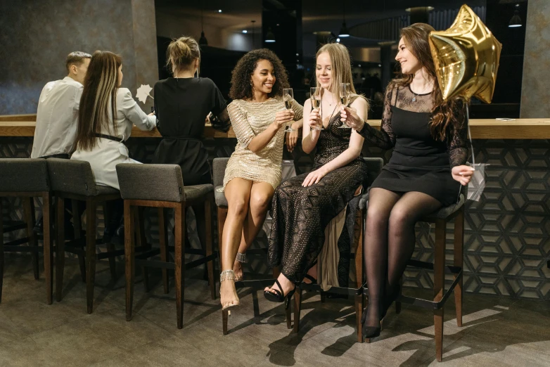 a group of women sitting next to each other at a bar, pexels contest winner, renaissance, party balloons, 15081959 21121991 01012000 4k, elegantly dressed, charcoal and champagne