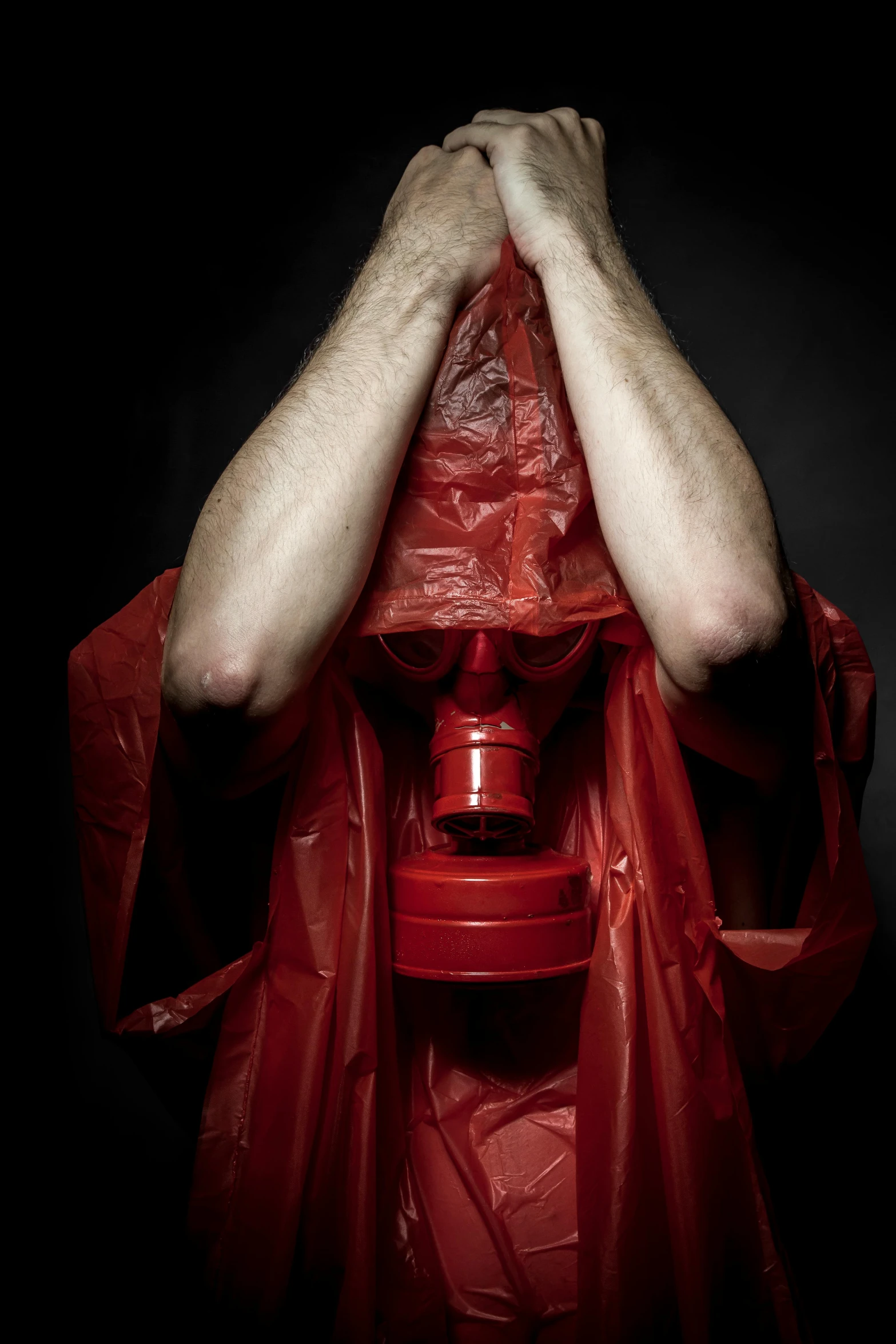 a man with a gas mask covering his face, an album cover, inspired by Nicola Samori, shutterstock contest winner, plasticien, red robe, thirst, shocked, an scp anomalous object