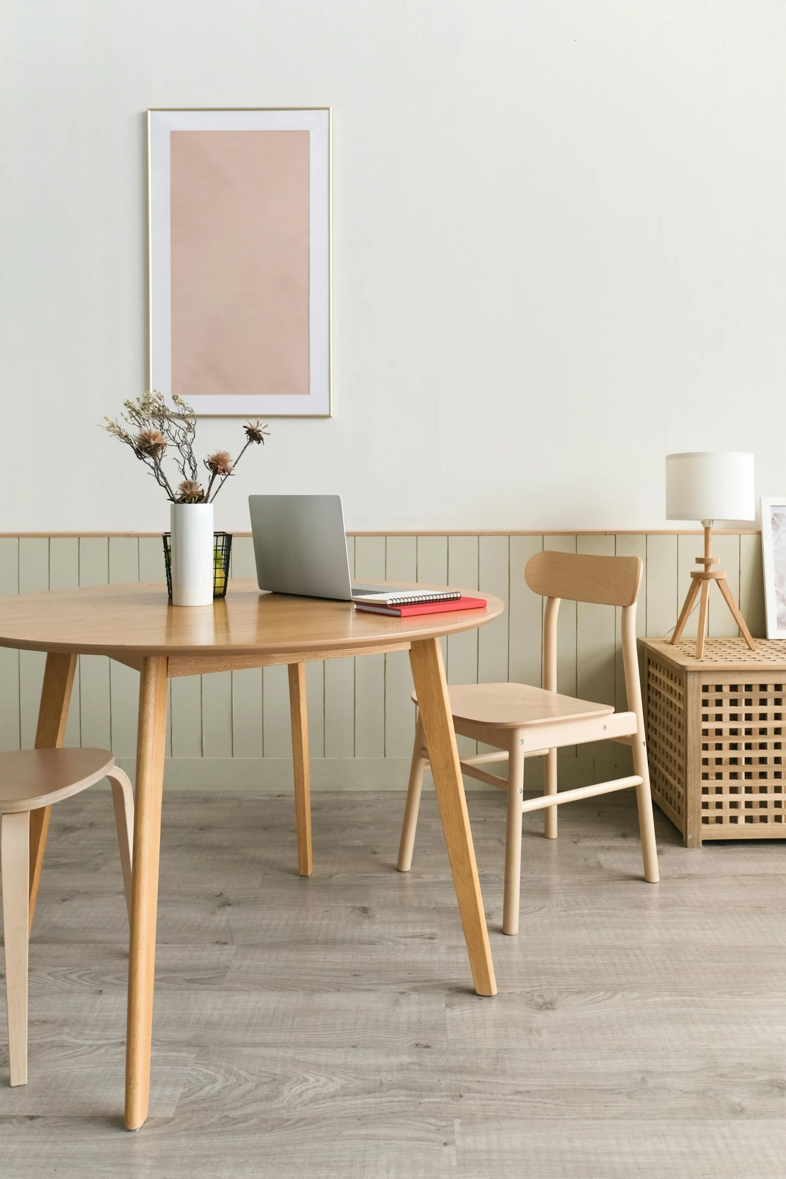 a laptop computer sitting on top of a wooden table, inspired by Constantin Hansen, trending on unsplash, minimalism, dining room, beige color scheme, round format, light wood