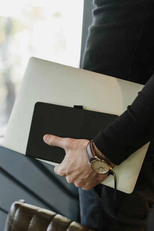 a close up of a person holding a laptop, by Carey Morris, corporate style, small, protective, ceo