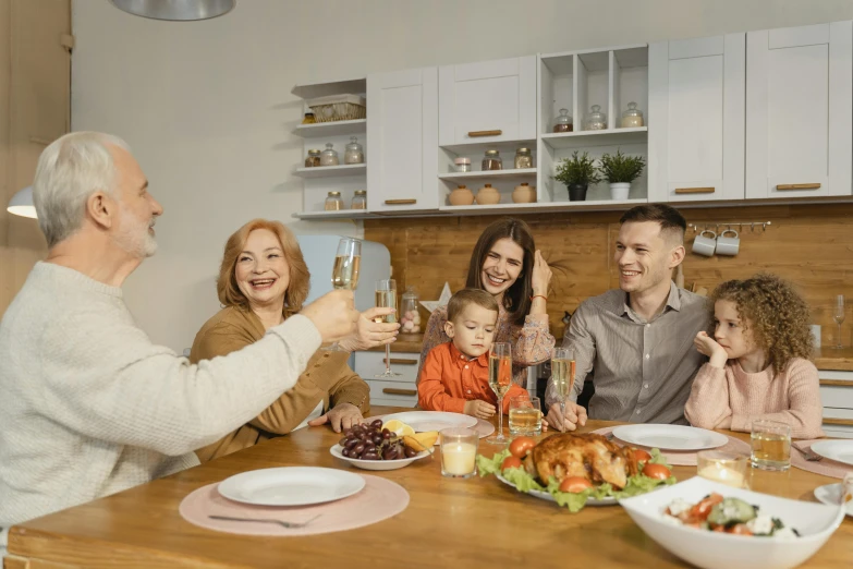 a group of people sitting around a wooden table, on kitchen table, profile image, the best, tv commercial