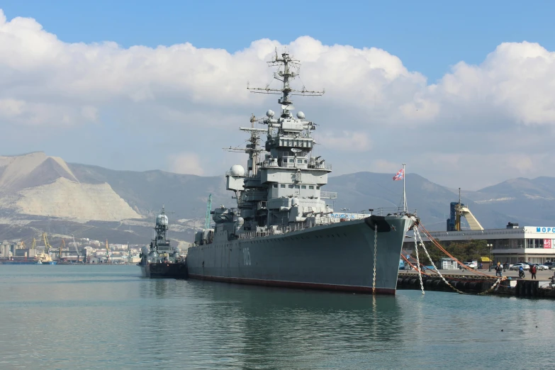 a large battleship sitting on top of a body of water, a portrait, by Carlo Martini, shutterstock, black sea, giants, mount, 2022 photograph