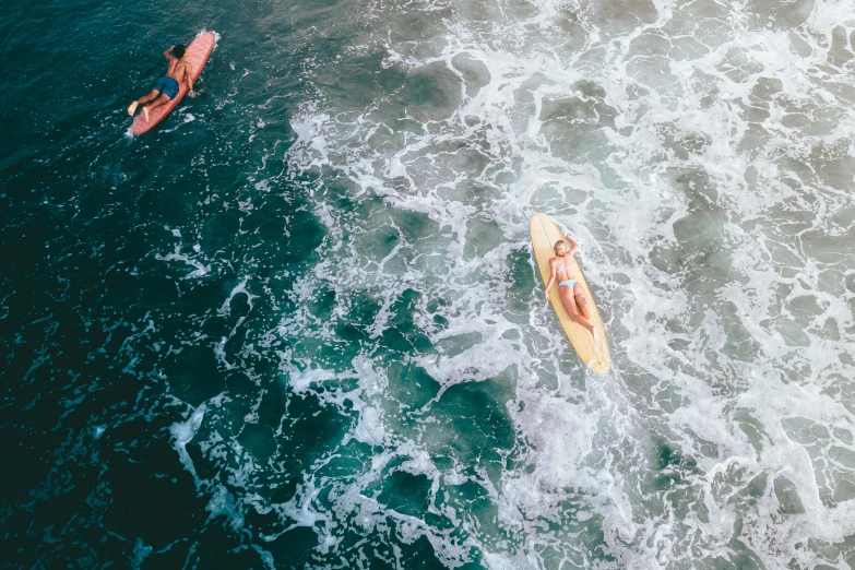 a couple of people riding surfboards on top of a wave, by Jessie Algie, pexels contest winner, flatlay, boats in the water, 🦩🪐🐞👩🏻🦳, tan