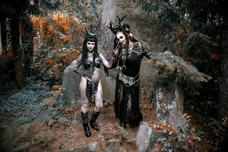 a couple of women standing next to each other in a forest, a photo, inspired by Brom, gothic art, wearing tribal armor, fullbody painting, contest winner 2021, instagram photo