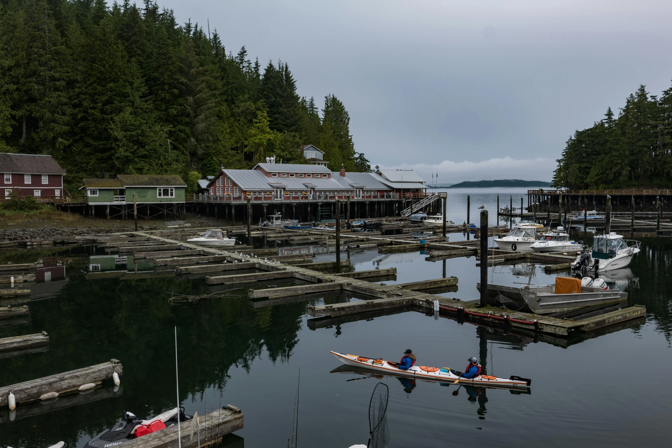 a couple of boats that are in the water, by Jessie Algie, pexels contest winner, vancouver school, longhouse, thumbnail, relaxing, small port village