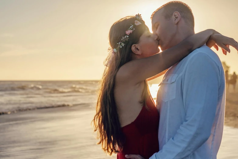 a man and a woman kissing on the beach, pexels contest winner, profile image, fan favorite, attractive girl, soft light