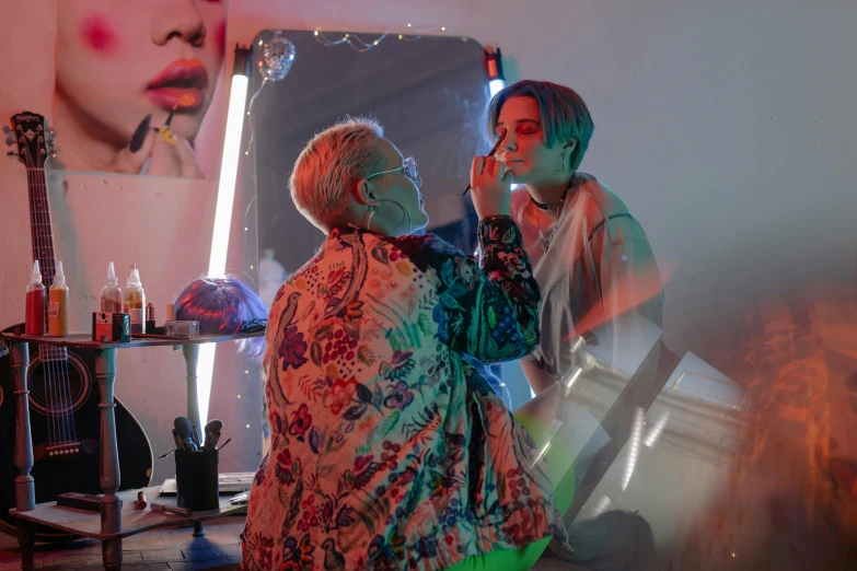 a woman getting her makeup done in front of a mirror, inspired by Elsa Bleda, cai xukun, colorful projections, julian ope, wlop and ross thran