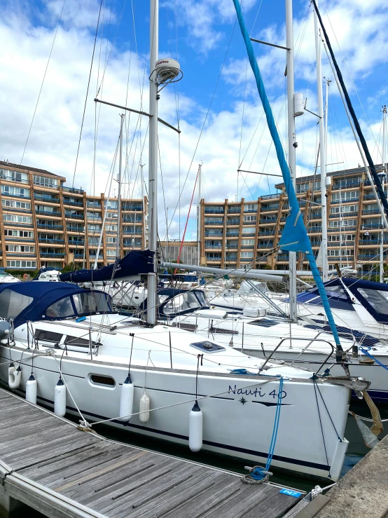 a couple of boats that are sitting in the water, full building, moored, profile image, apartment