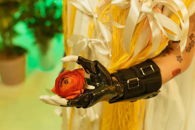 a close up of a person holding a flower, a surrealist sculpture, inspired by Lucas Cranach the Elder, doomfist from overwatch, leather gloves, from final fantasy xiii, wedding