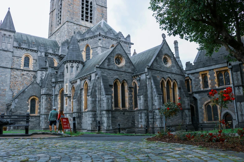 a large stone building with a clock tower, pexels contest winner, romanesque, book of kells, grey, red fluid on walls of the church, thumbnail