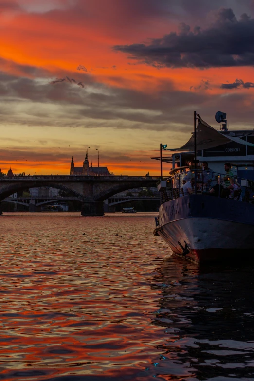 a boat that is sitting in the water, by Antoni Brodowski, prague, sunset panorama, shot on sony a 7, ship