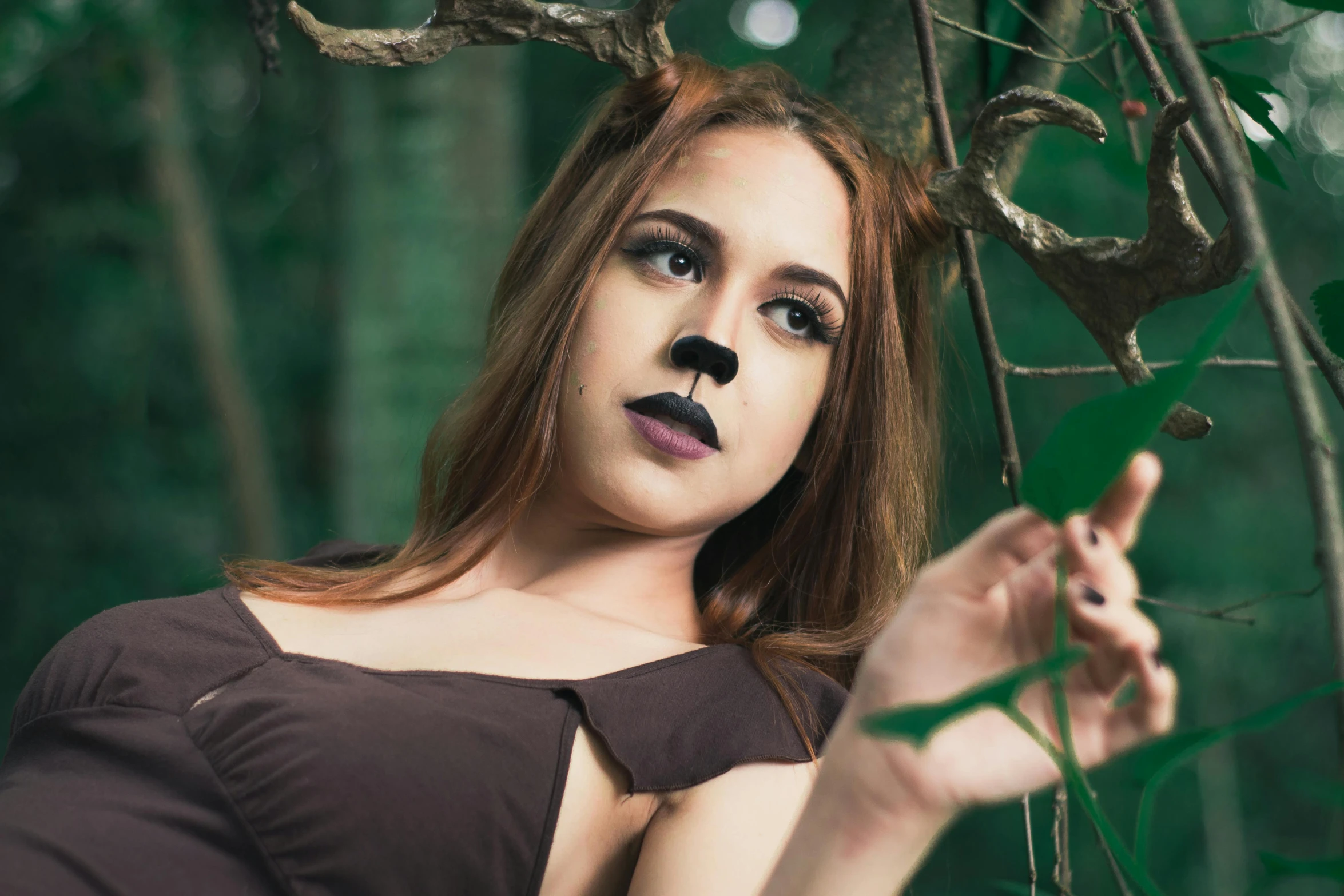 a woman is posing for a picture in the woods, pexels contest winner, renaissance, disney's bambi cat, dark lipstick, profile image, cosplay photo