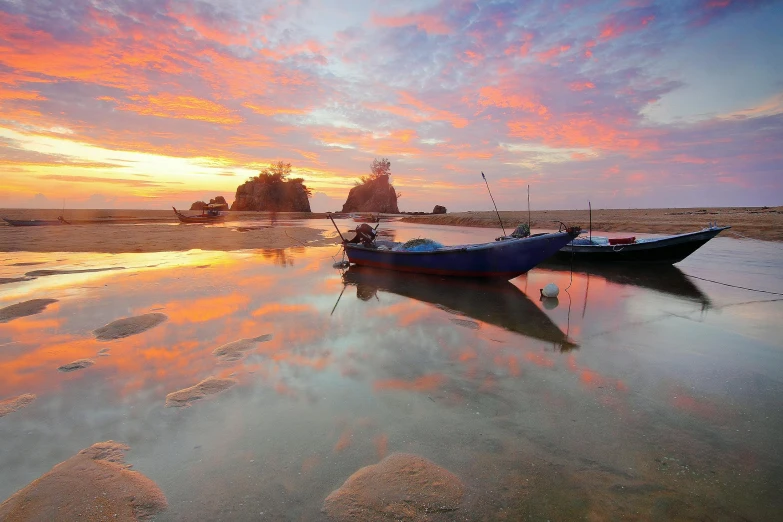 a couple of boats sitting on top of a beach, by Basuki Abdullah, unsplash contest winner, sumatraism, pink reflections, sunset panorama, multicoloured, 3 boat in river